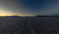 Dark Desert Mountains Surrounding Salt Lake: A Nature Packshot