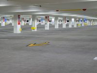 a empty parking lot with yellow arrows for parking and markings on the ground, the sign indicates where to park
