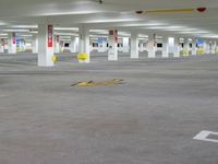 a empty parking lot with yellow arrows for parking and markings on the ground, the sign indicates where to park