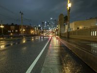 city lights shine brightly above a dark street in this shot of an old style road