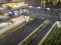 a view of a road and an overpass with traffic passing through it by buildings