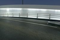 an empty freeway at night as cars leave the roadway and turn off for another lane