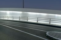 an empty freeway at night as cars leave the roadway and turn off for another lane