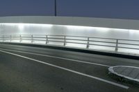 an empty freeway at night as cars leave the roadway and turn off for another lane