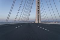 Dawn: Architecture of a Blue Suspension Bridge