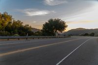 Dawn and Armco Barrier in Rural Landscape