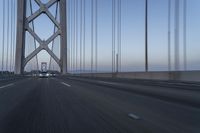 Dawn on Asphalt Road with Cable-stayed Bridge