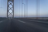 Dawn on Asphalt Road with Cable-stayed Bridge