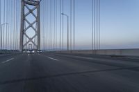 Dawn on Asphalt Road with Cable-stayed Bridge