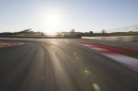 Dawn on the Asphalt Road: Field POV Shot