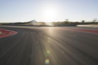 Dawn on the Asphalt Road: Field POV Shot