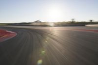 Dawn on the Asphalt Road: Field POV Shot