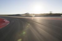 Dawn on the Asphalt Road: Field POV Shot