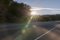 Dawn on Asphalt Road: A Picturesque Rural Landscape