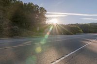 Dawn on Asphalt Road: A Picturesque Rural Landscape