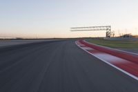 Dawn Automobile Racing on an Asphalt Road