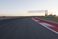 Dawn Automobile Racing on an Asphalt Road