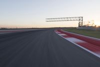 Dawn Automobile Racing on an Asphalt Road