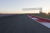 Dawn Automobile Racing on an Asphalt Road