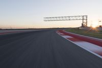 Dawn Automobile Racing on an Asphalt Road