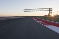 Dawn Automobile Racing on an Asphalt Road