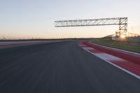 Dawn Automobile Racing on an Asphalt Road