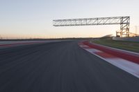 Dawn Automobile Racing on an Asphalt Road