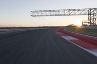 Dawn Automobile Racing on an Asphalt Road