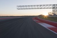 Dawn Automobile Racing on an Asphalt Road