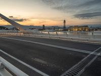 Dawn in Barcelona: Cityscape, Bridge, and Ocean