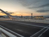 Dawn in Barcelona: Cityscape, Bridge, and Ocean