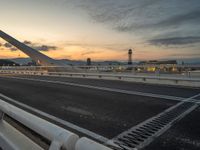 Dawn in Barcelona: Cityscape, Bridge, and Ocean