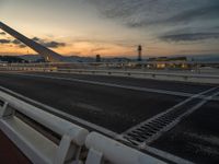 Dawn in Barcelona: Cityscape, Bridge, and Ocean