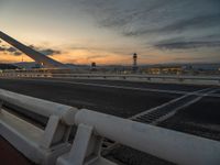 Dawn in Barcelona: Cityscape, Bridge, and Ocean