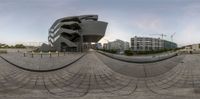 this fish eye lens is looking out on a cityscape from the center of the photo