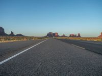 Dawn Breaking: Asphalt Road and Clear Sky