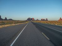 Dawn Breaking: Asphalt Road and Clear Sky