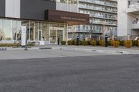 a parking meters in front of a building at the time of completion of work on