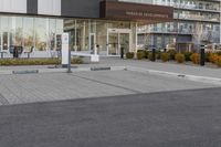 a parking meters in front of a building at the time of completion of work on