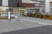 a parking meters in front of a building at the time of completion of work on