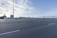 a empty road that is almost empty except for the people to walk around it and do not want to run into the distance