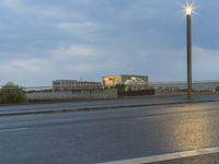 Dawn on the City Streets of Berlin: Water Reflections and Urban Lights