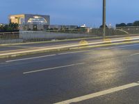 Dawn on the City Streets of Berlin: Water Reflections and Urban Lights