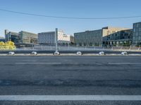 a empty city street with some construction work in the background for a business district image