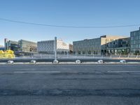 a empty city street with some construction work in the background for a business district image