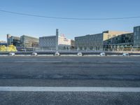 a empty city street with some construction work in the background for a business district image