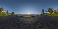 view of the sun through a mirror lens of a skateboarder doing a trick