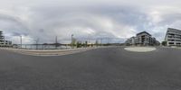 a small, circular picture is captured in the middle of the road with other buildings on each side of the circle