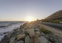 Dawn on a Coastal Road: Asphalt and Mountain Views