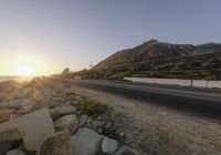 Dawn on a Coastal Road: Asphalt and Mountain Views